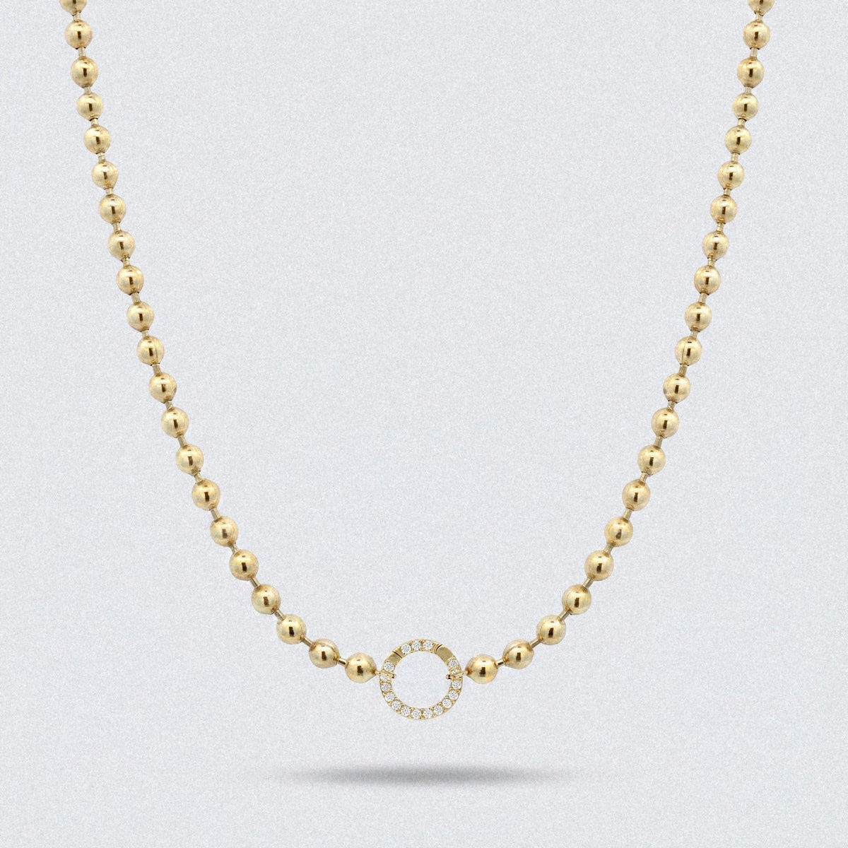 Ball chain necklace in solid yellow gold with a diamond centre ring